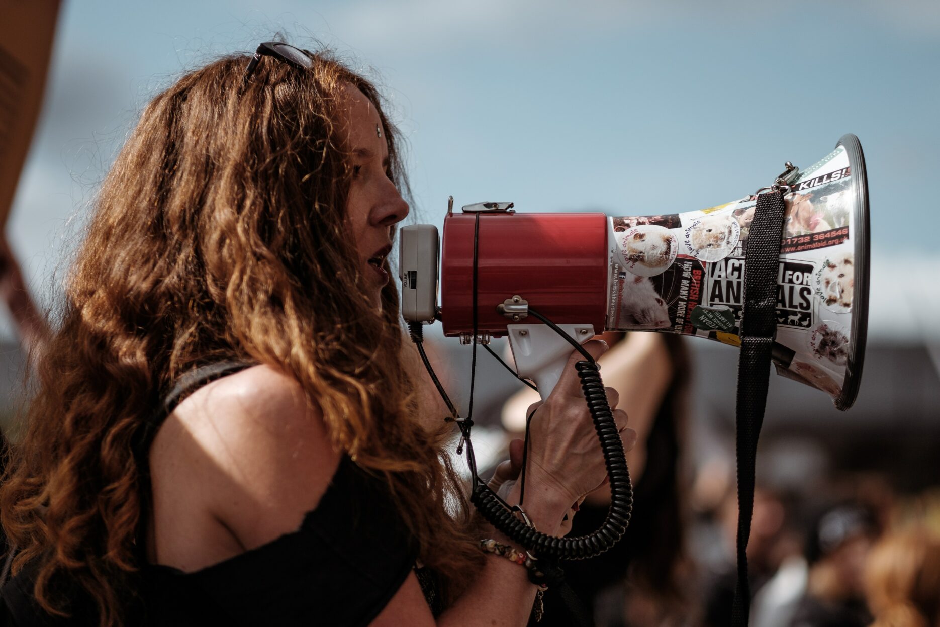 A woman speaks into a megaphone.