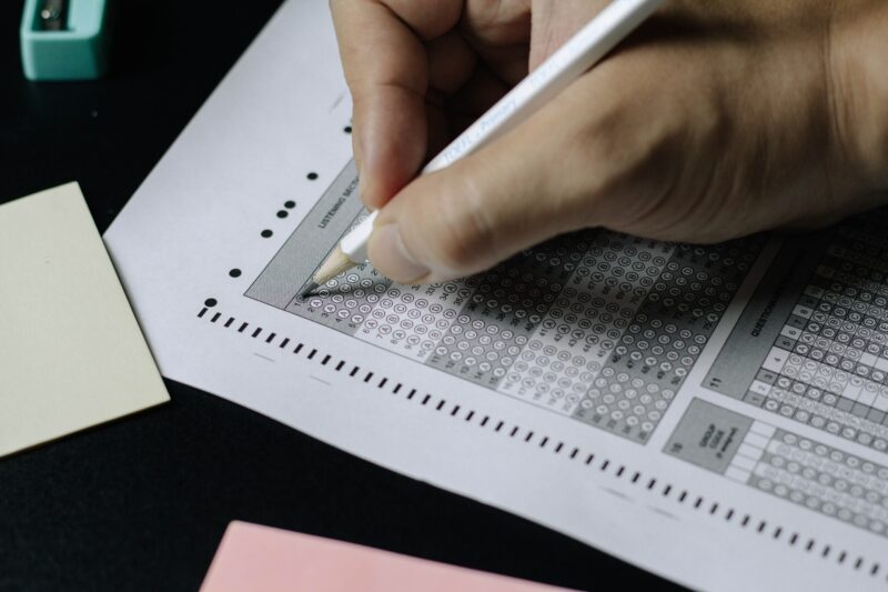 An image of a person taking a scantron exam.